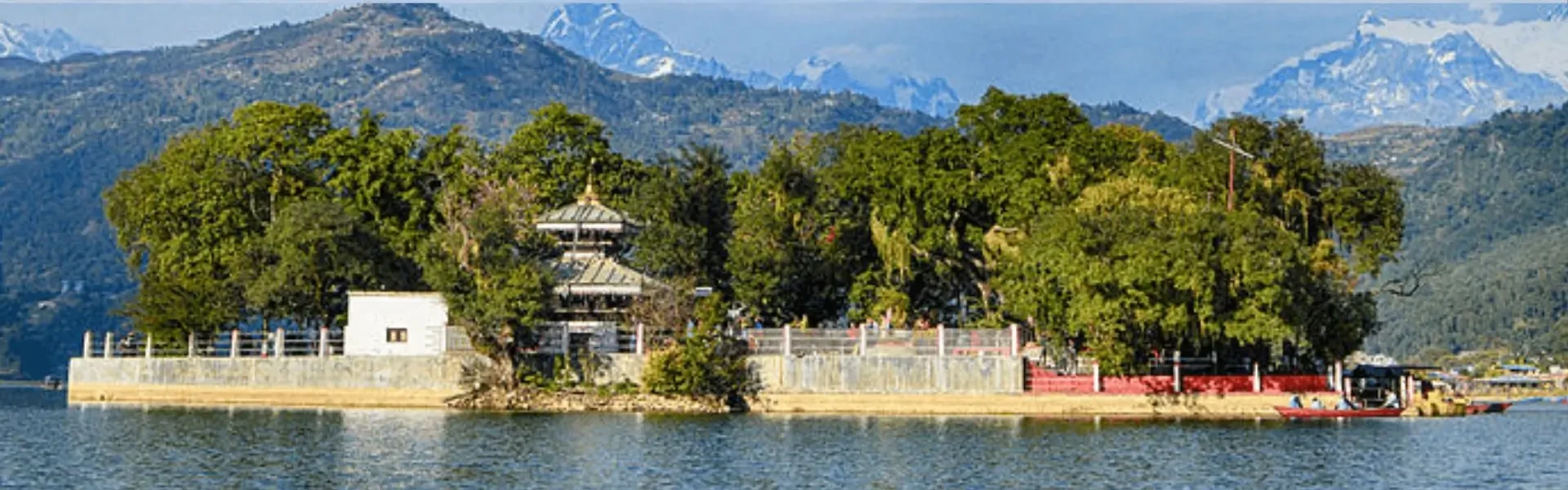 Scenic view of Phewa Lake with mountains in Pokhara, Nepal